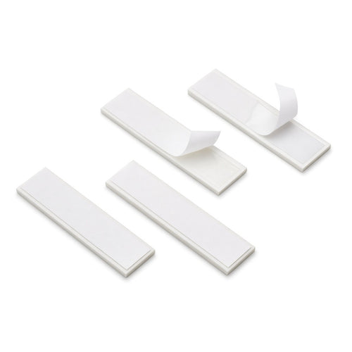 White rectangular double-sided adhesive strips with peel-off liners for fitting number plates